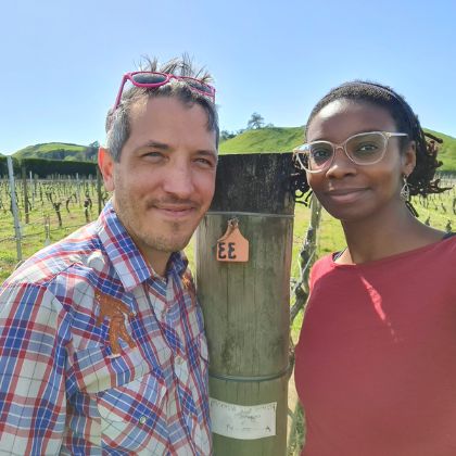 Diana and Frank standing in front of their Syrah block in the Bridge Pa Triangle